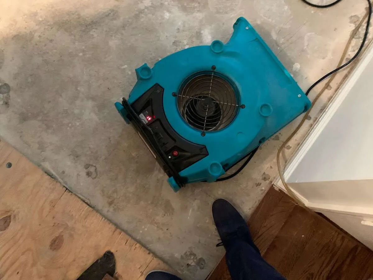 Air mover drying subfloor during Leak Detection & Repair in Universal City